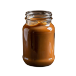 Frasco de vidrio lleno de dulde de leche sin etiqueta